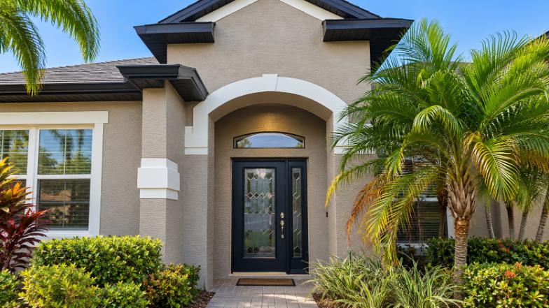 navy blue front door Orlando Florida stucco home