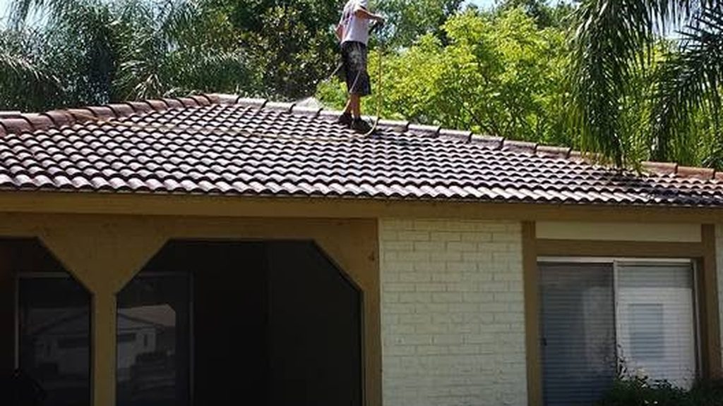 Philip White crew soft washing a roof in Orlando, FL